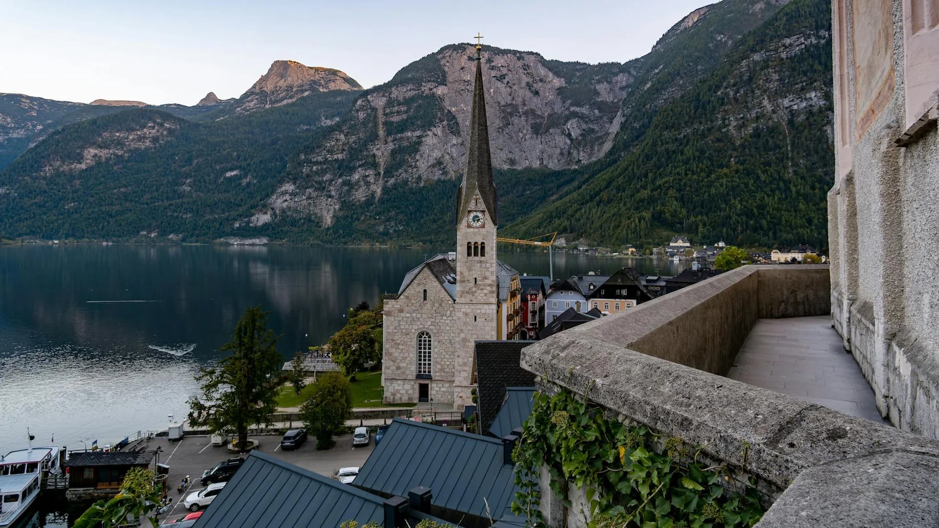 Hallstatt iconic church and Alpine backdrop in winter daylight