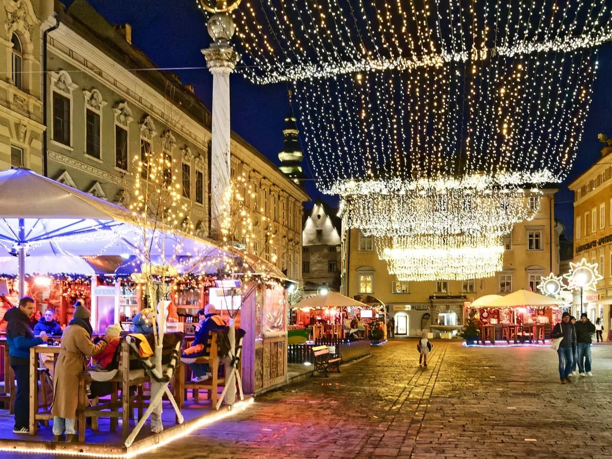 Klagenfurt Neuer Platz adorned with festive lights during Christmas season