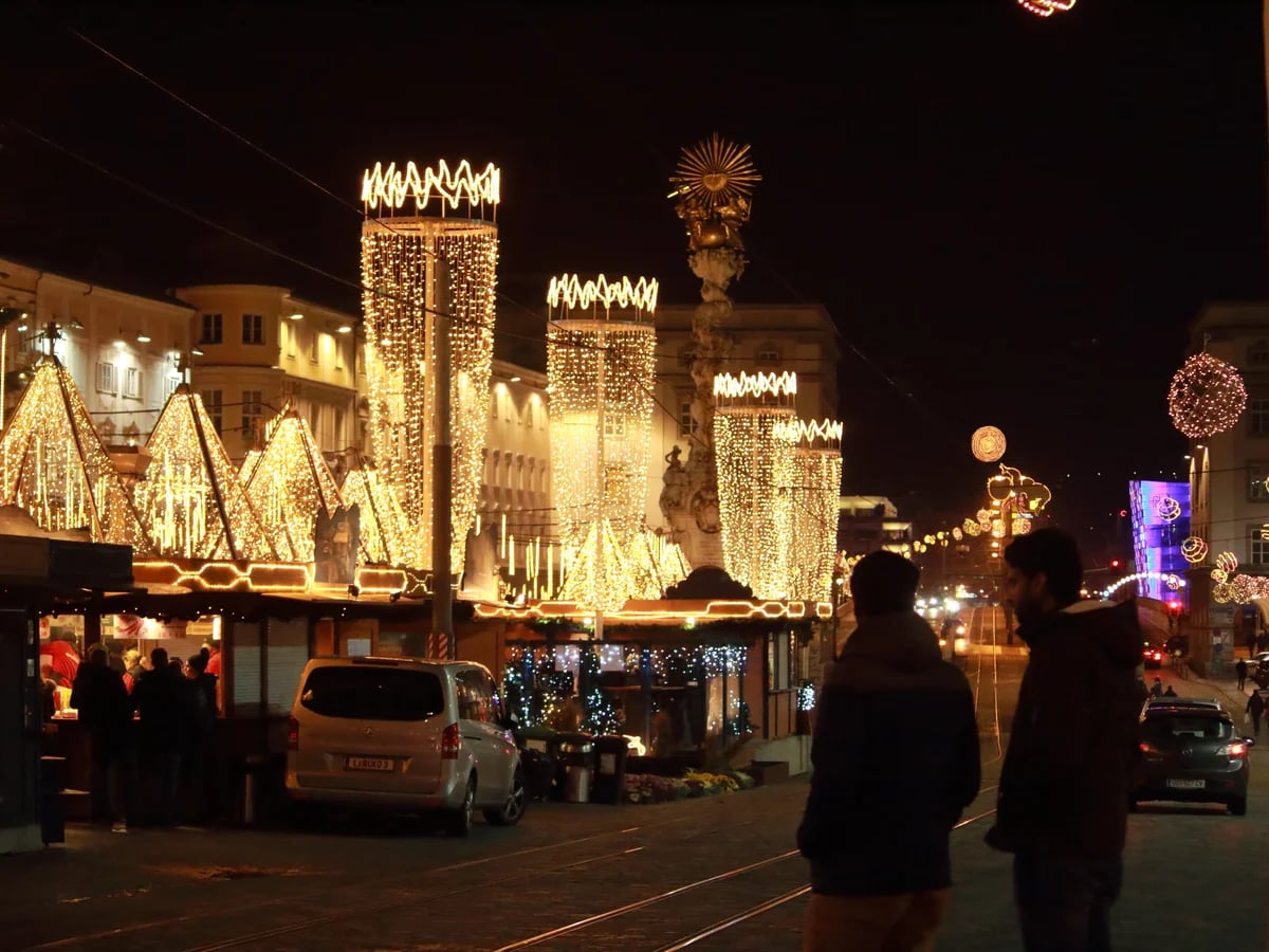 Linz Hauptplatz adorned with festive lights during the winter Christmas season