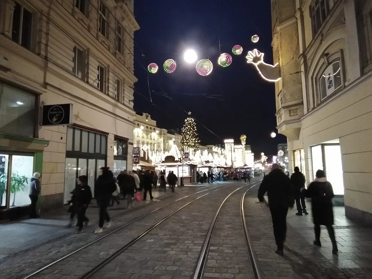 Linz Schmidtorstraße decorated with festive lights during winter season