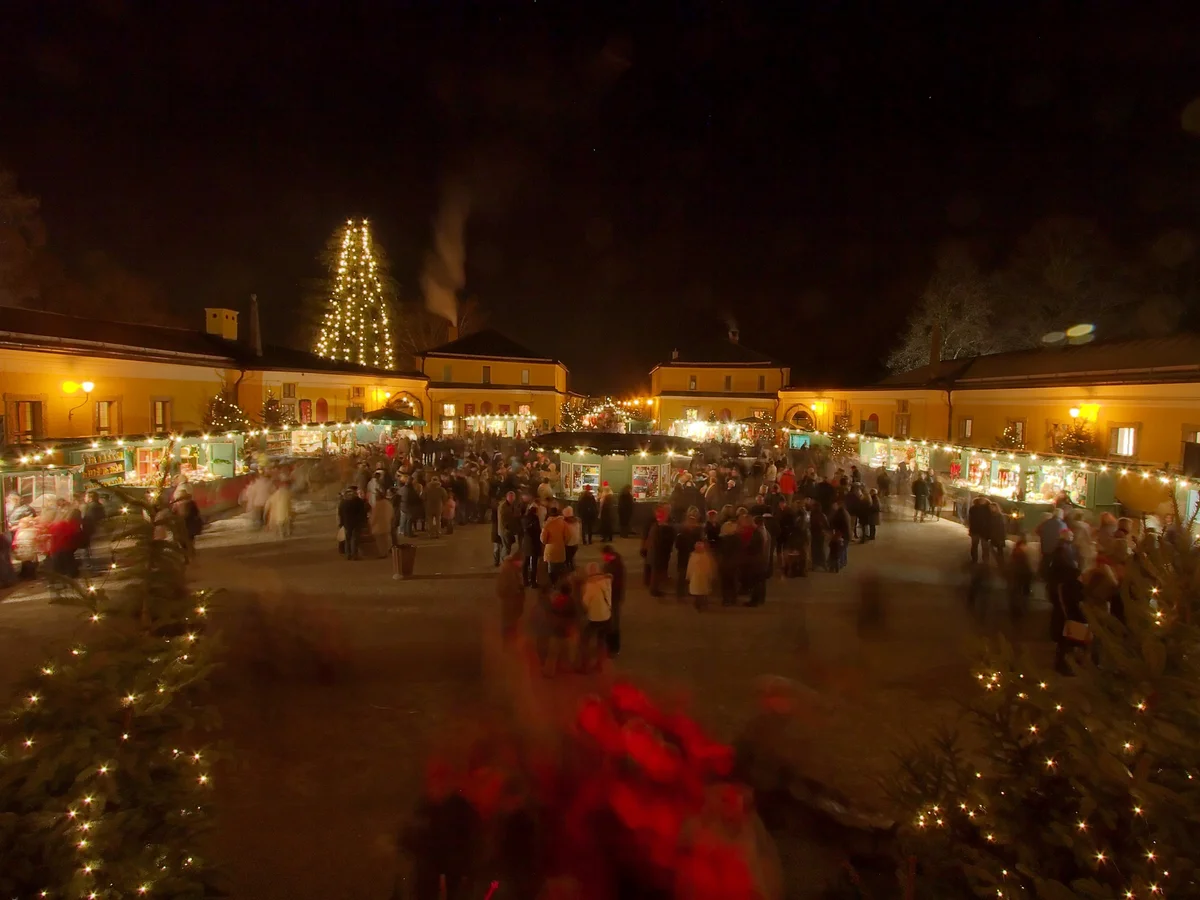 Salzburg bustling Christmas market at twilight with warm lights
