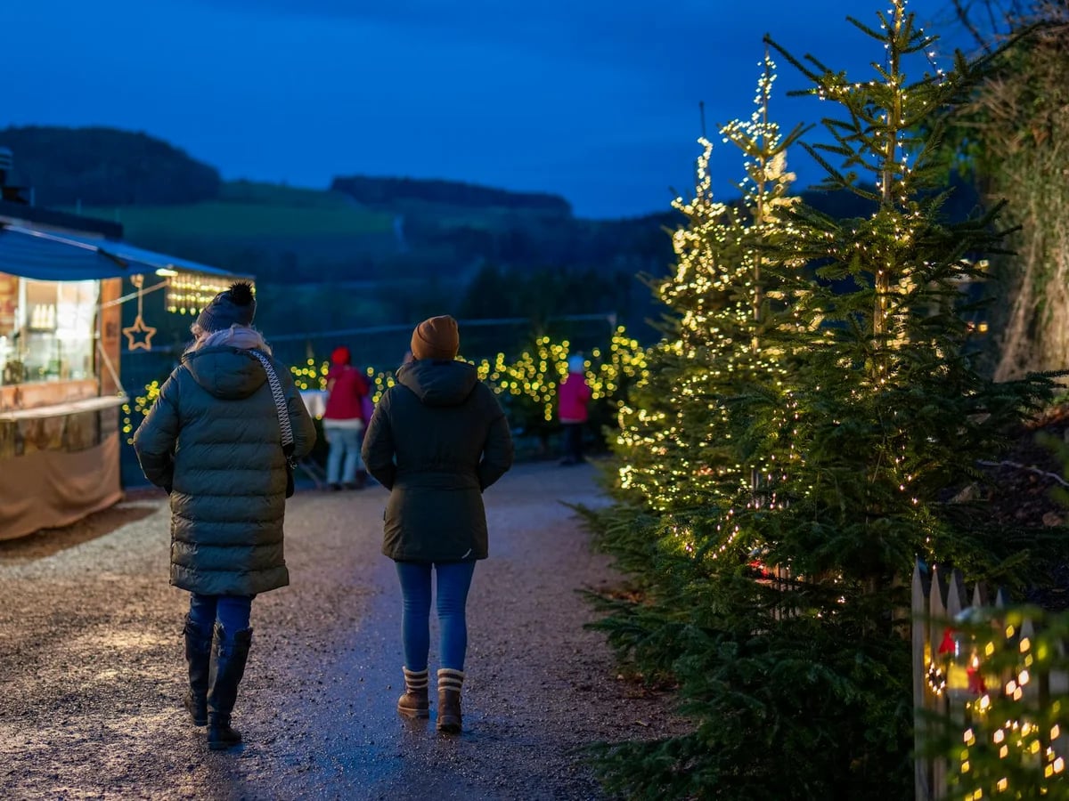 St. Wolfgang illuminated Christmas market at twilight in winter