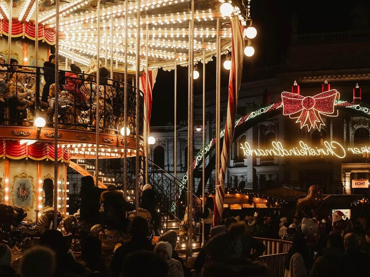 Vienna ornate carousel lights up the winter Christmas market atmosphere