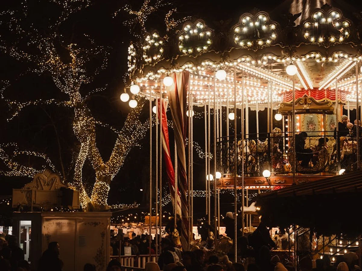 Vienna traditional carousel glowing at night during Christmas season