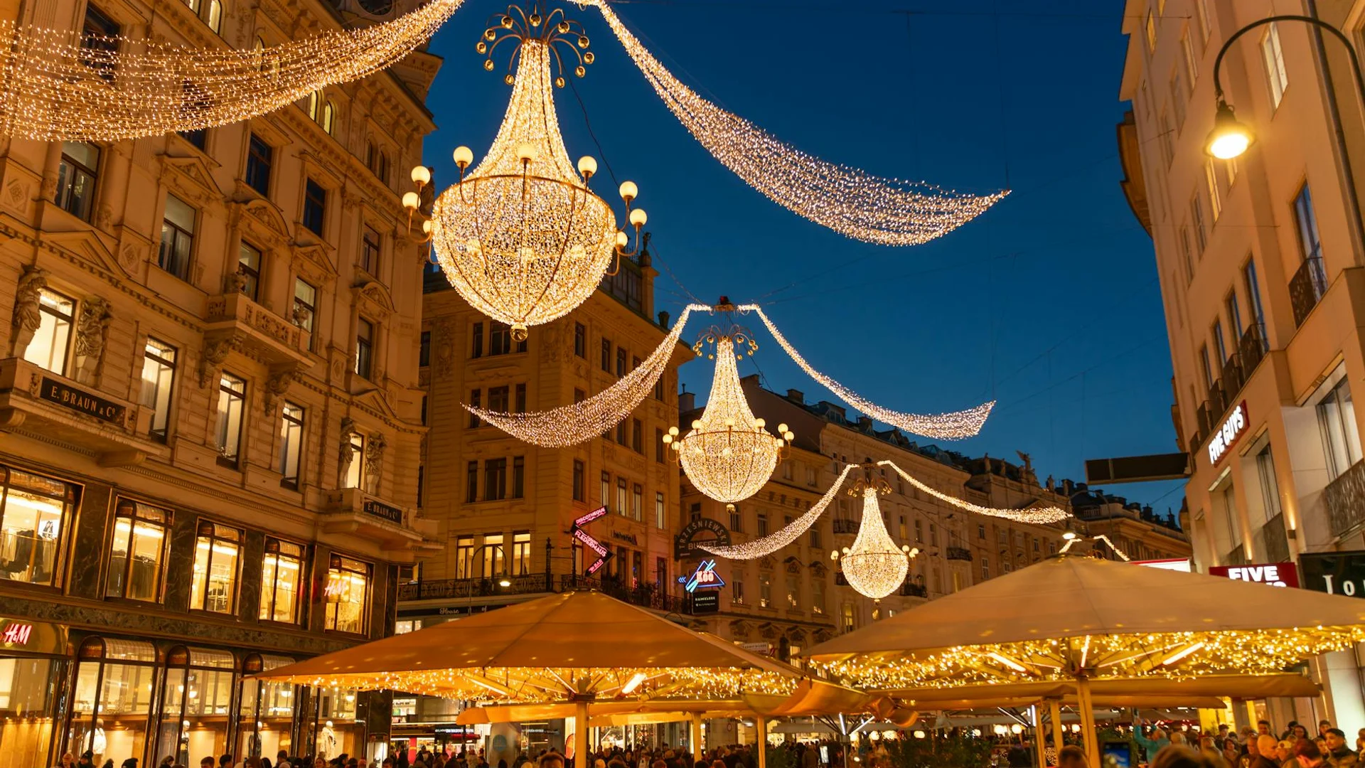 Vienna Graben Street adorned with illuminated chandeliers during winter festivities
