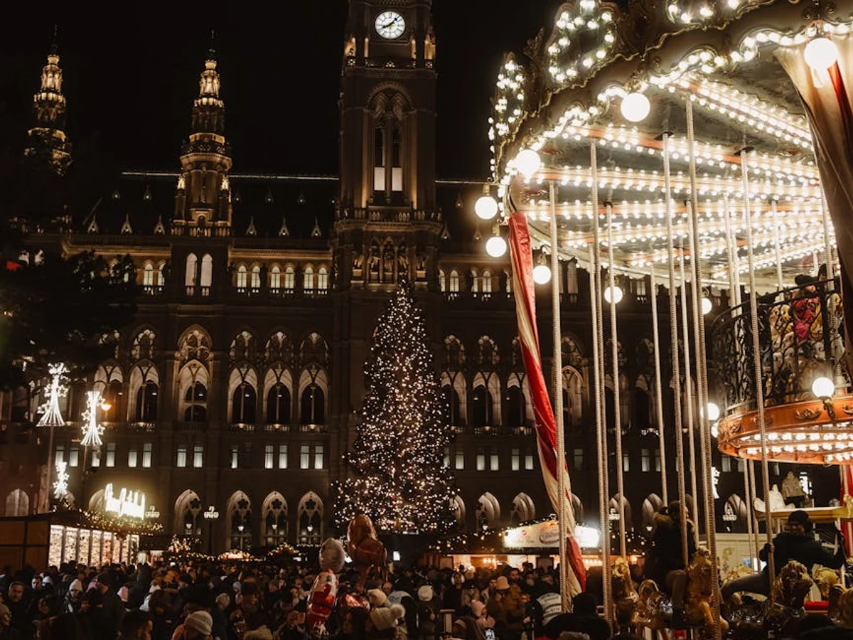 Vienna Rathaus illuminated during festive Christmas market in winter