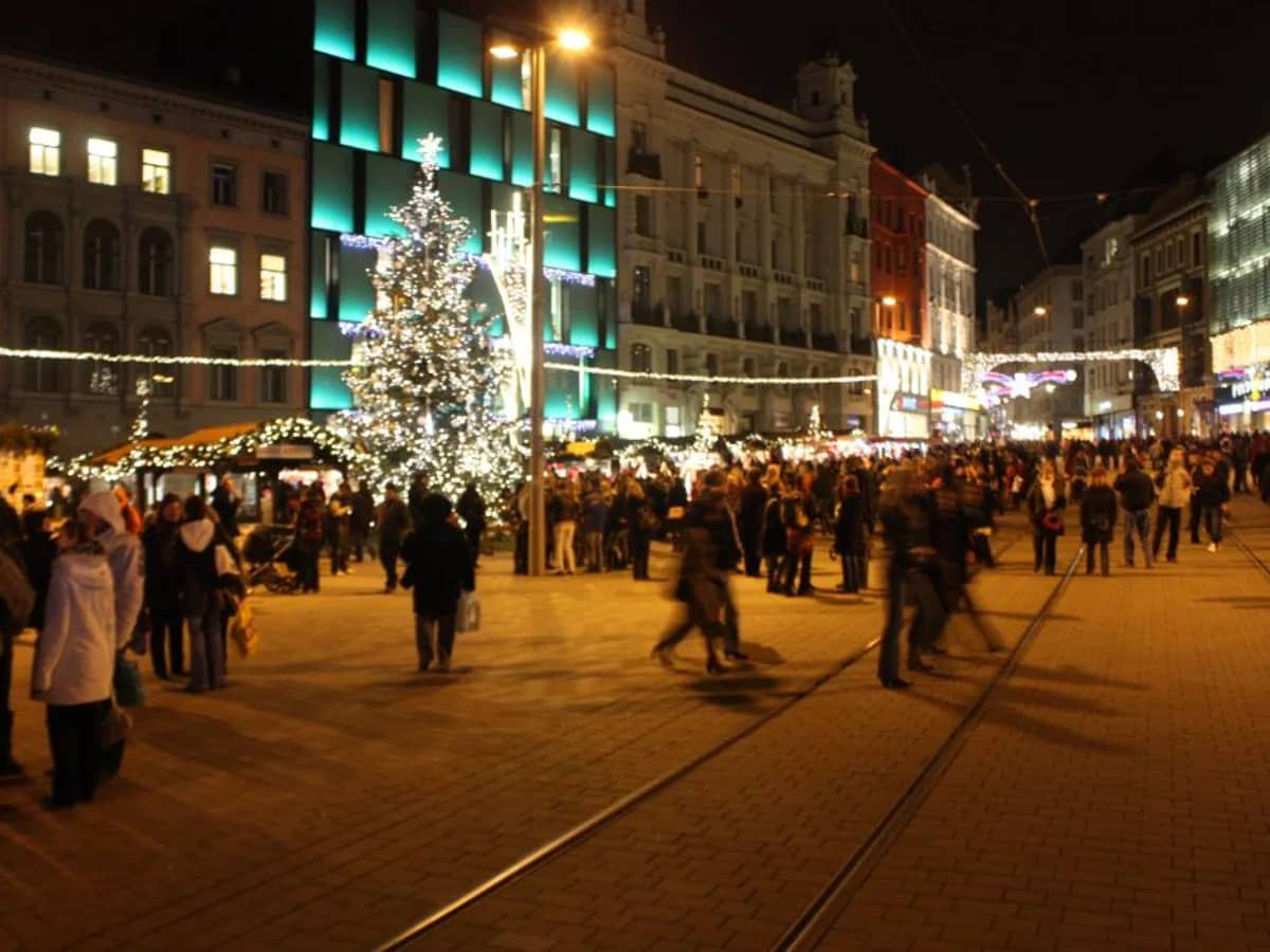 Brno main square illuminated by a giant Christmas tree during winter festivities