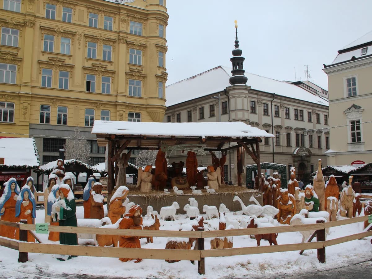Brno nativity scene framed by snow-covered Central European architecture during winter