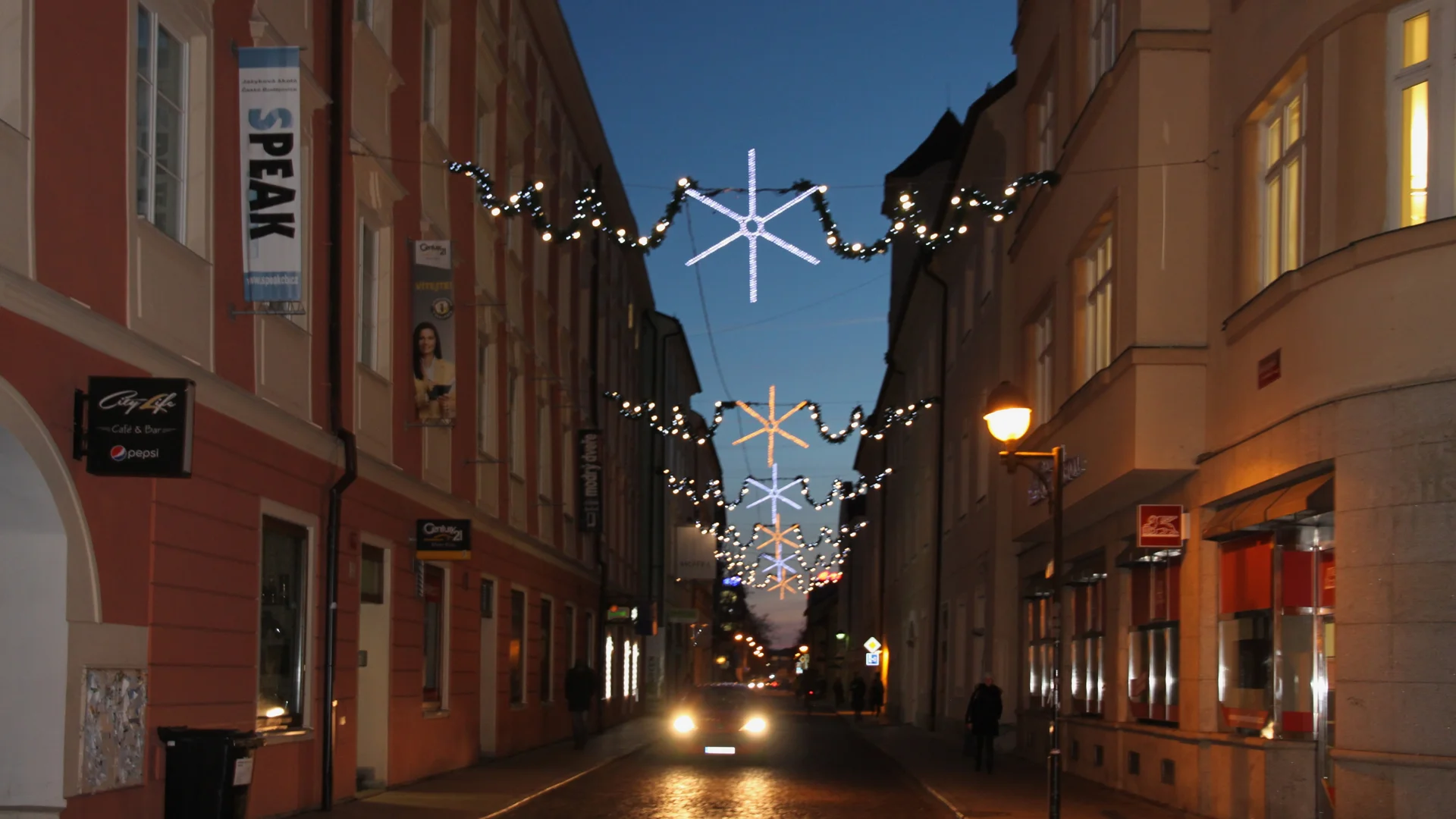 České Budějovice blue hour street scene with geometric star decorations during Christmas season
