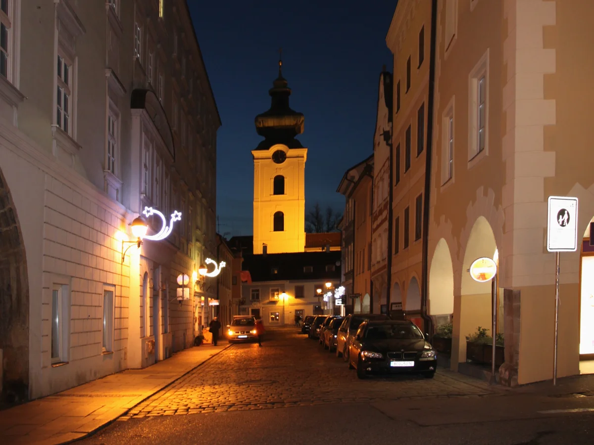 České Budějovice illuminated church tower at blue hour in winter
