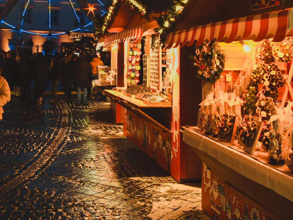 Karlovy Vary festive Christmas market with blue Ferris wheel at night