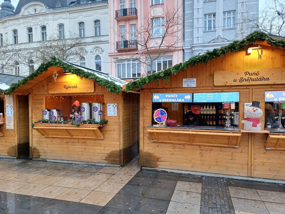 Ostrava authentic Christmas market stalls in winter with Belle Époque architecture