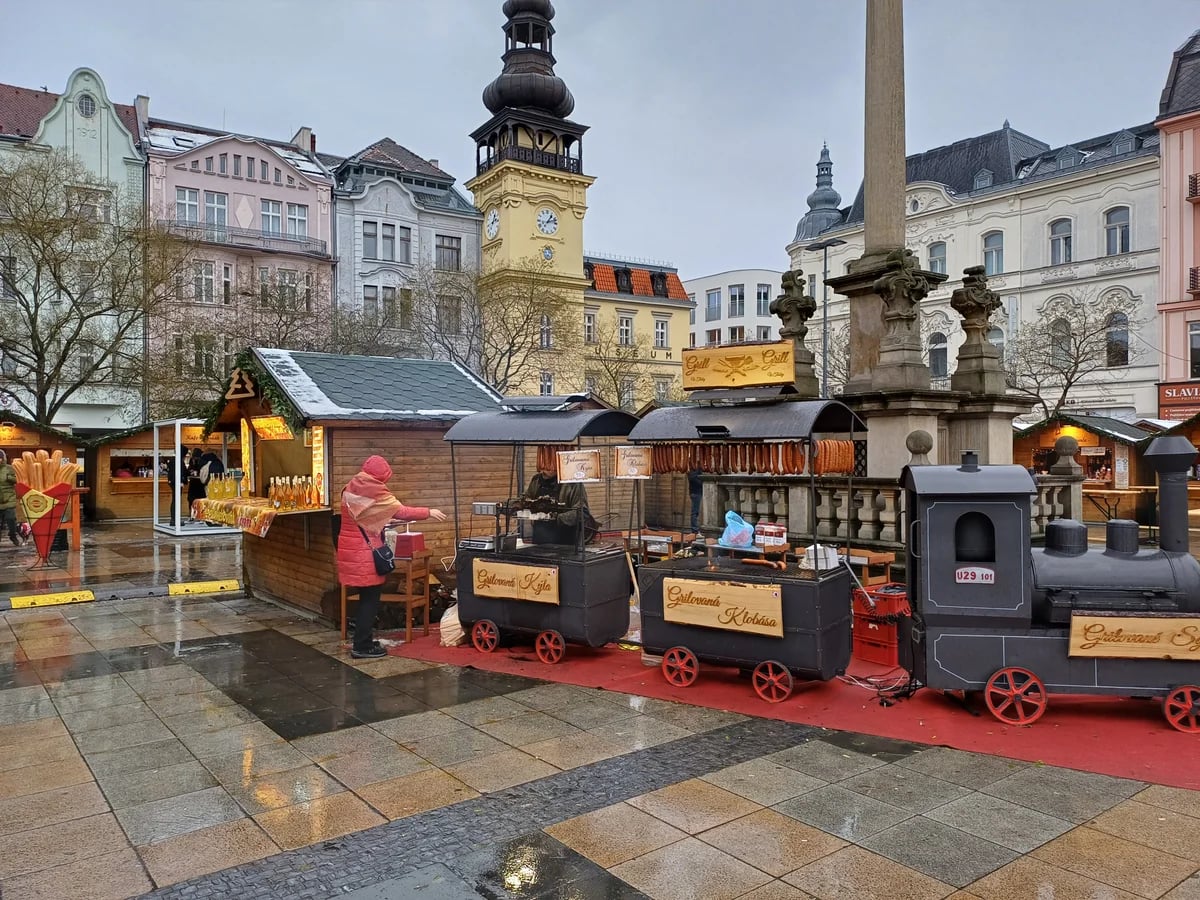 Ostrava yellow clock tower at Masarykovo náměstí during winter Christmas market