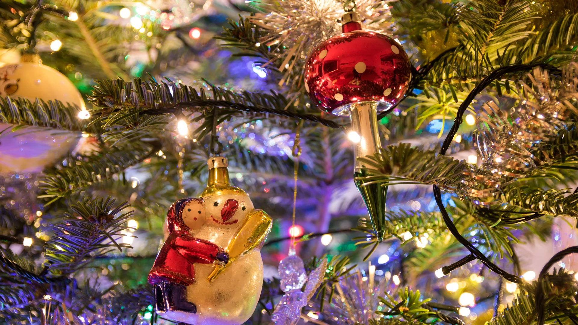 Festive decorations and colorful lights at a European Christmas market, evoking holiday magic.