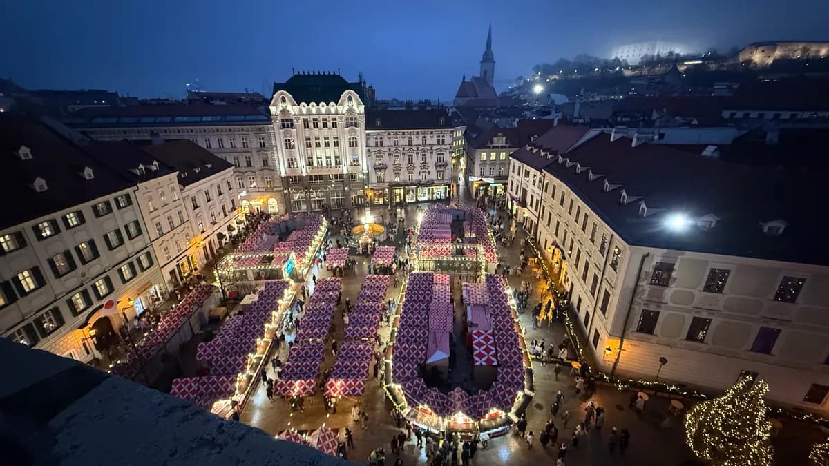 A stunning aerial view of an unknown festive Christmas market, filled with lights and decorations.