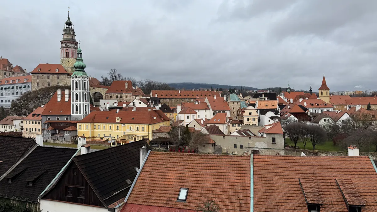 Festive decorations and lights illuminate the Unknown Christmas market in a picturesque Central European town.