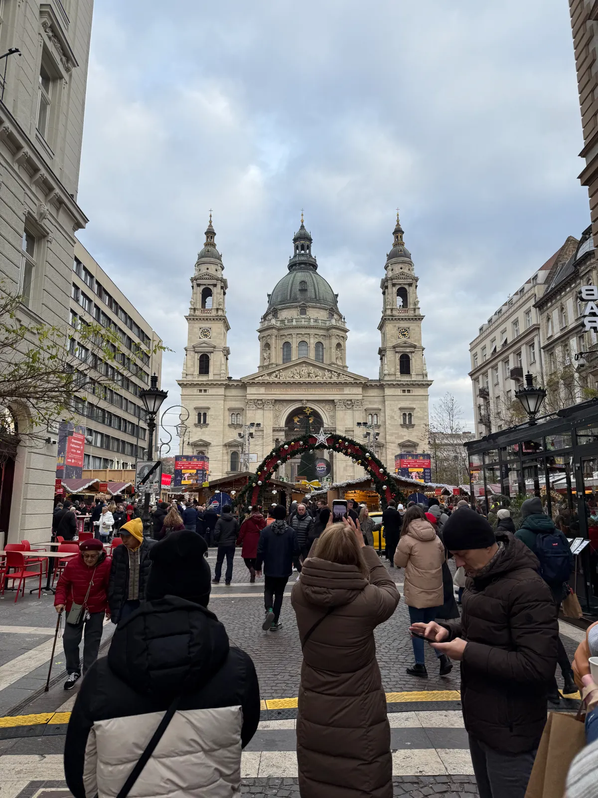 Festive decorations and bright lights at an Unknown Christmas market, creating a magical holiday atmosphere.