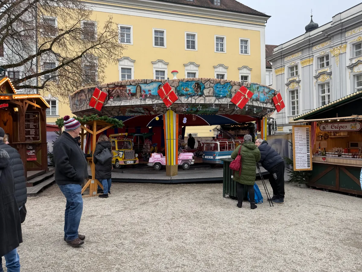 Festive decorations and colorful lights at an unknown Christmas market, creating a magical holiday atmosphere.