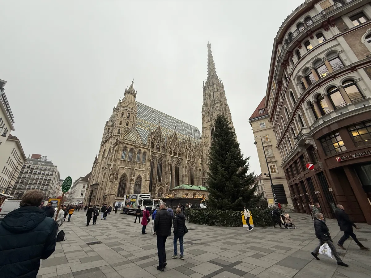 Unknown Christmas market with festive decorations and lights near St. Stephen's Cathedral in Vienna.