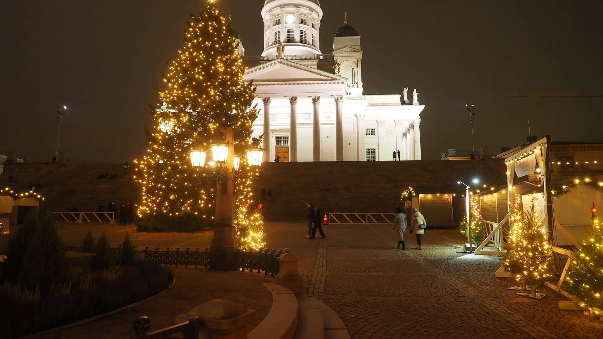 Helsinki Cathedral illuminated during festive winter season at Christmas market