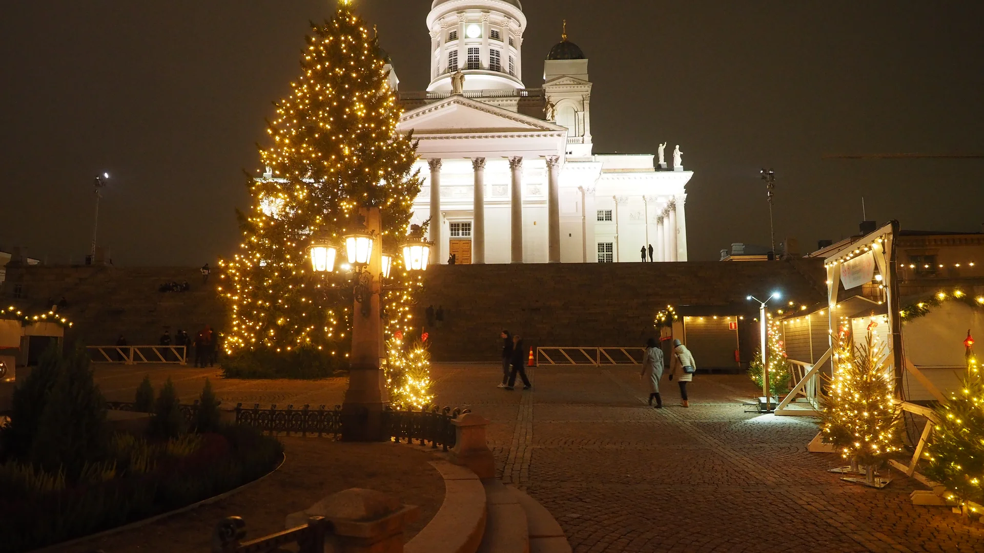 Helsinki Cathedral illuminated during festive winter season at Christmas market