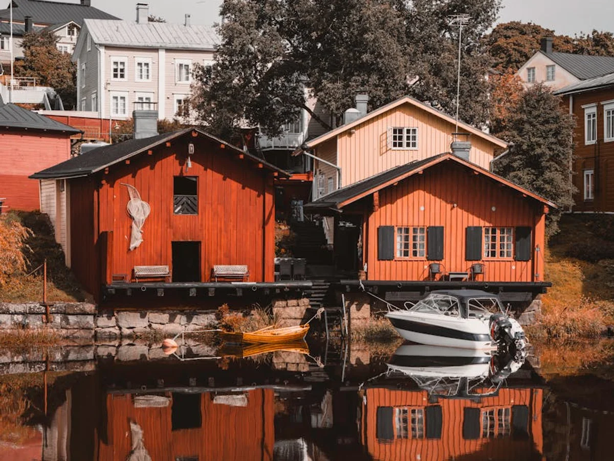 Porvoo iconic red boathouses reflecting in the river during winter season
