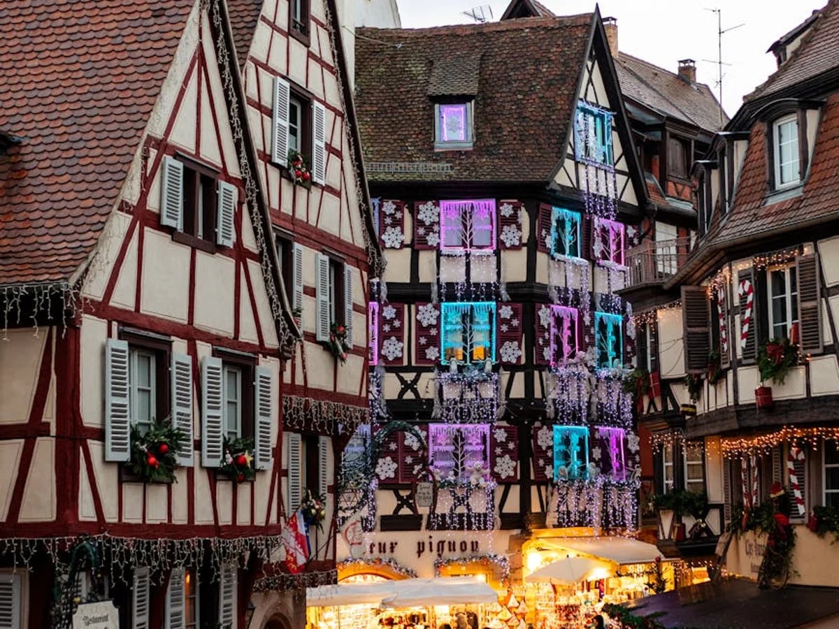 Colmar half-timbered architecture illuminated during Christmas market season