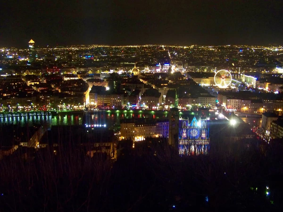 Lyon illuminated cityscape with Fourvière Basilica during the festive winter season