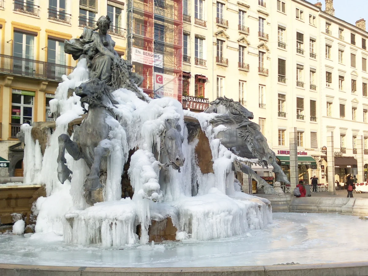 Lyon frozen Fontaine Bartholdi surrounded by winter beauty
