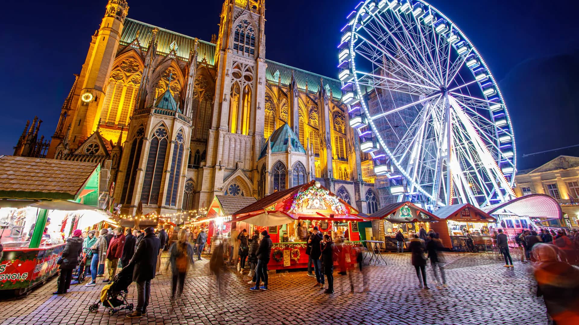Metz Cathedral illuminated at twilight during the festive Metz Christmas market