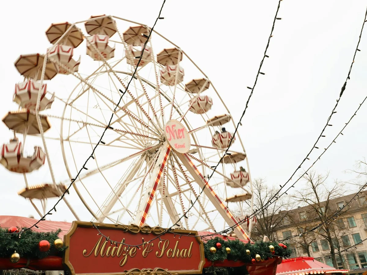 Mulhouse vintage carousel adorned with festive garland during Christmas season