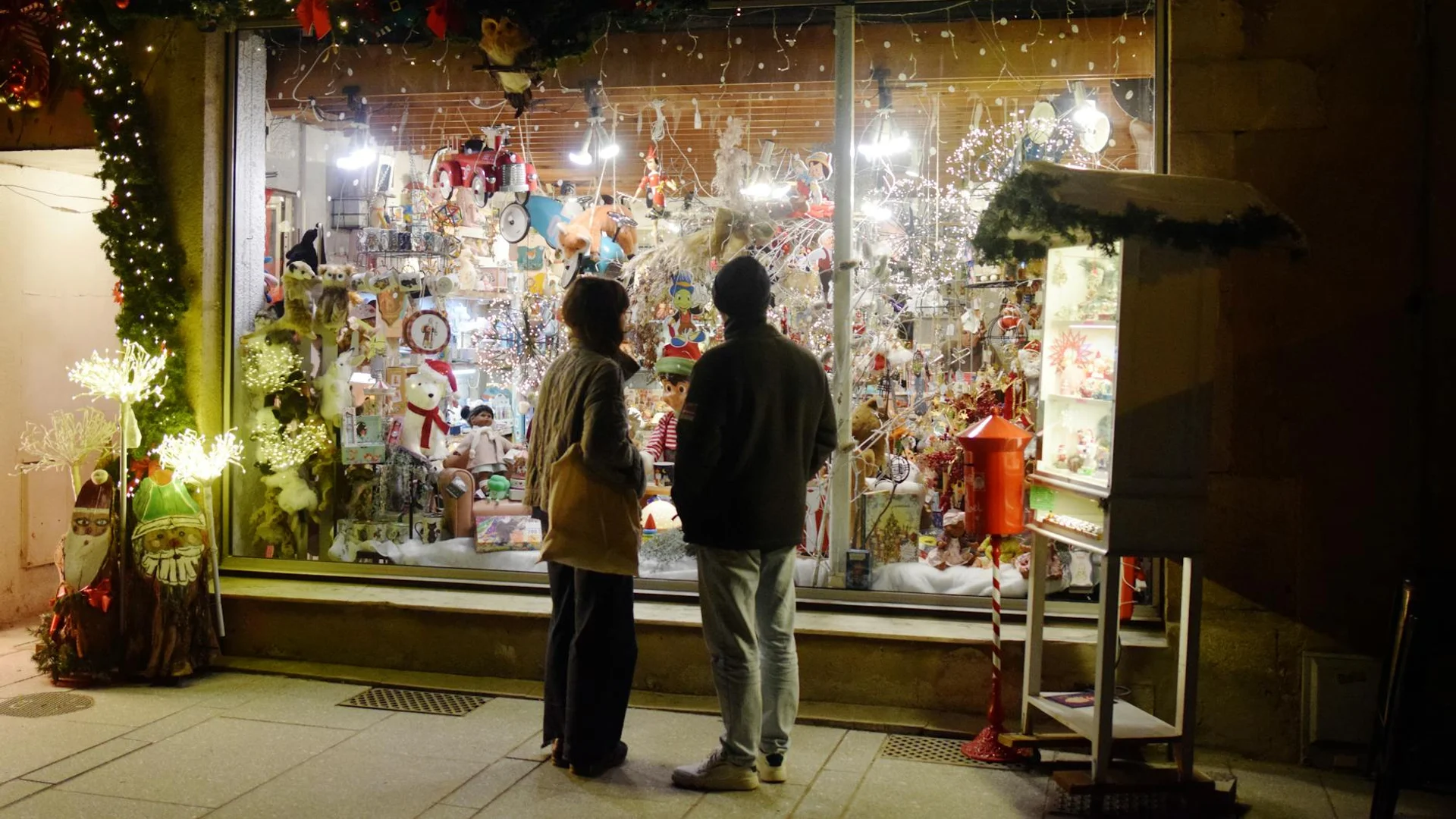 Nancy beautifully illuminated Christmas shop window during winter evening