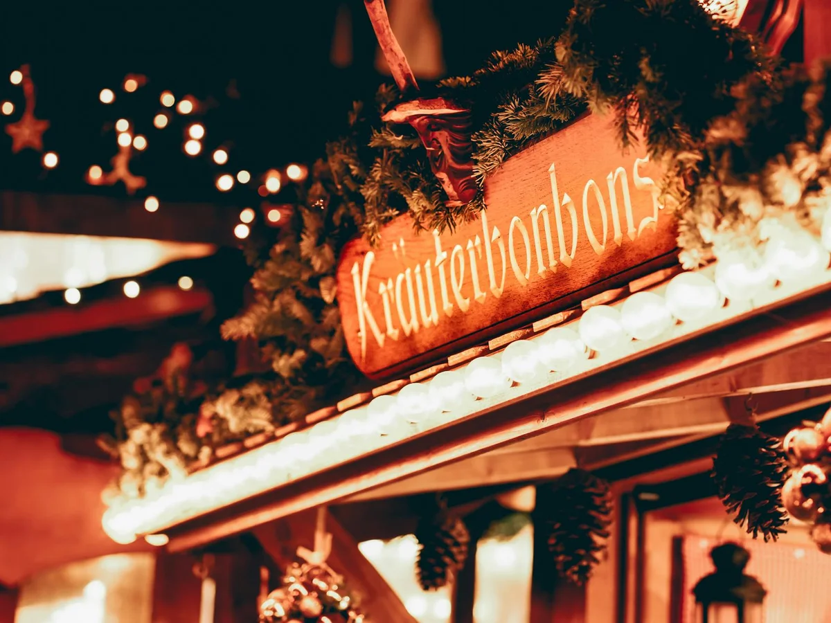 Nantes festive market stall glowing with warm lights during winter season