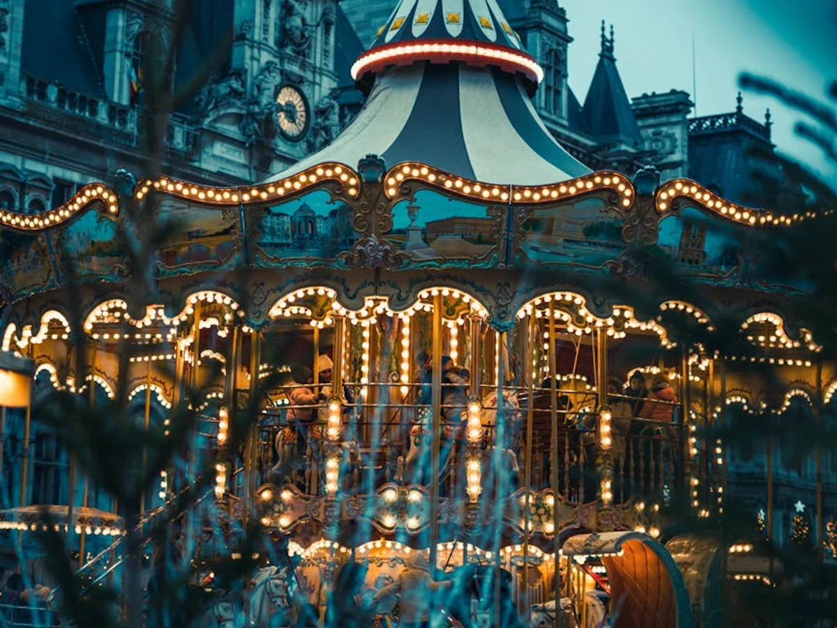 Paris vintage carousel glowing during Christmas in winter evening