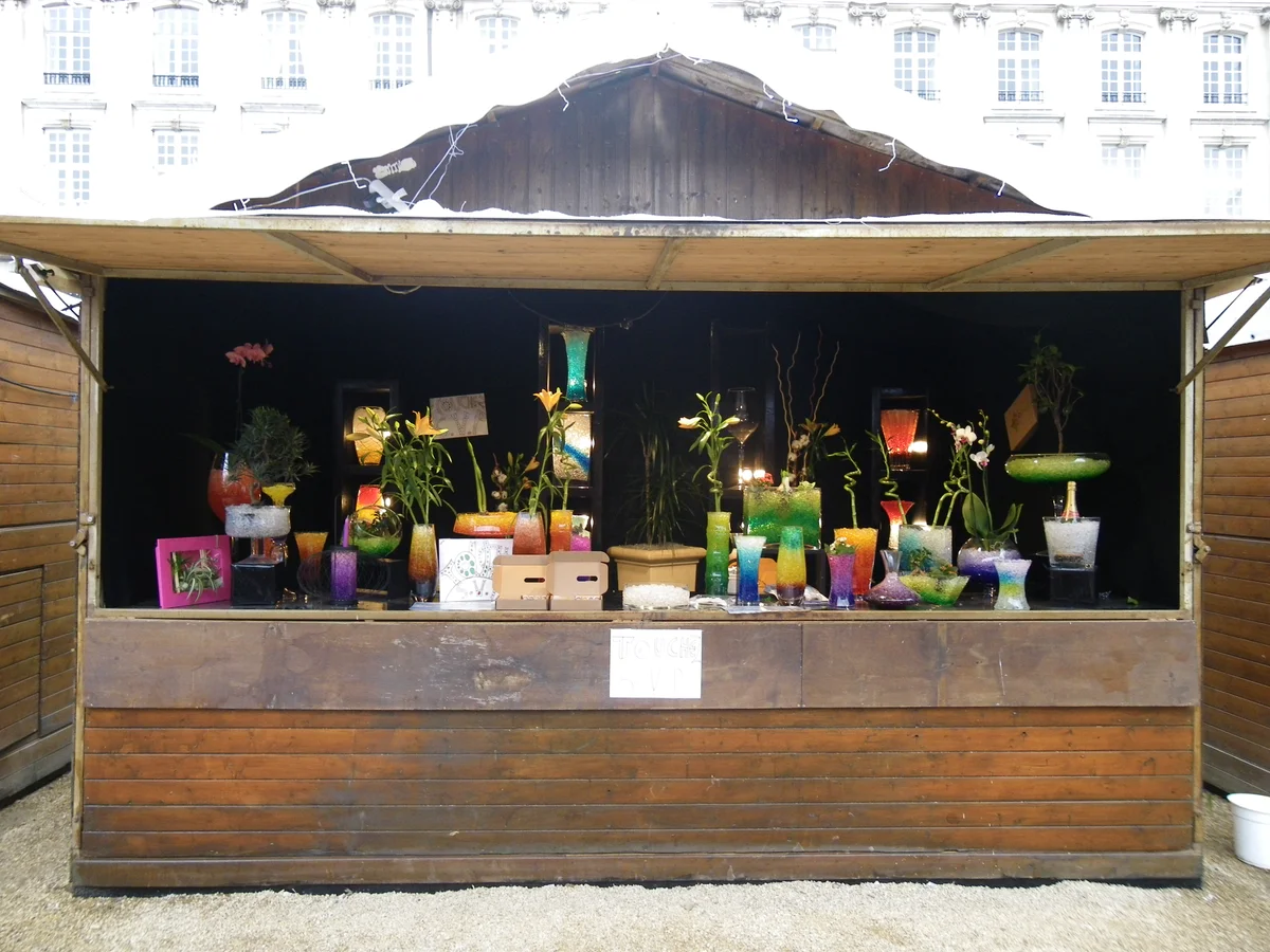 Rennes authentic Christmas market stall with Haussmann architecture backdrop