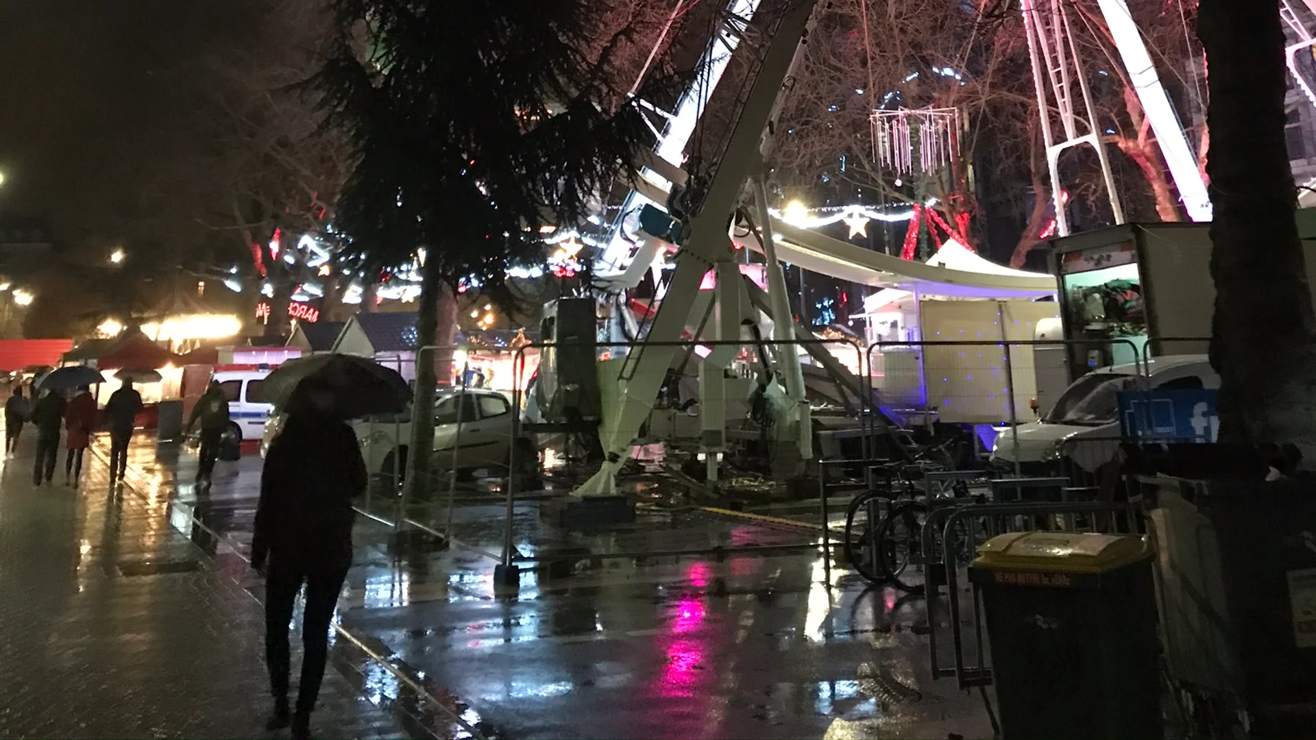 Rennes magenta-lit Ferris wheel at night during Christmas season