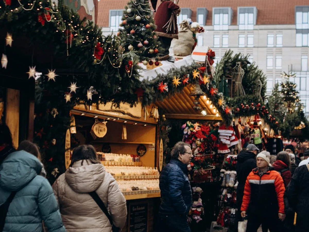 Augsburg Christmas market scene with festive decorations and visitors enjoying winter ambiance