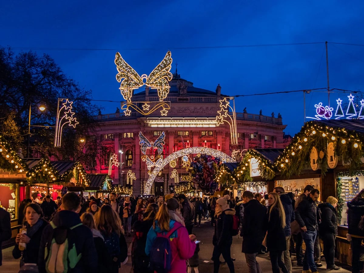 Augsburger Christkindlesmarkt illuminated at dusk in Augsburg with angel wings and Rathausplatz atmosphere