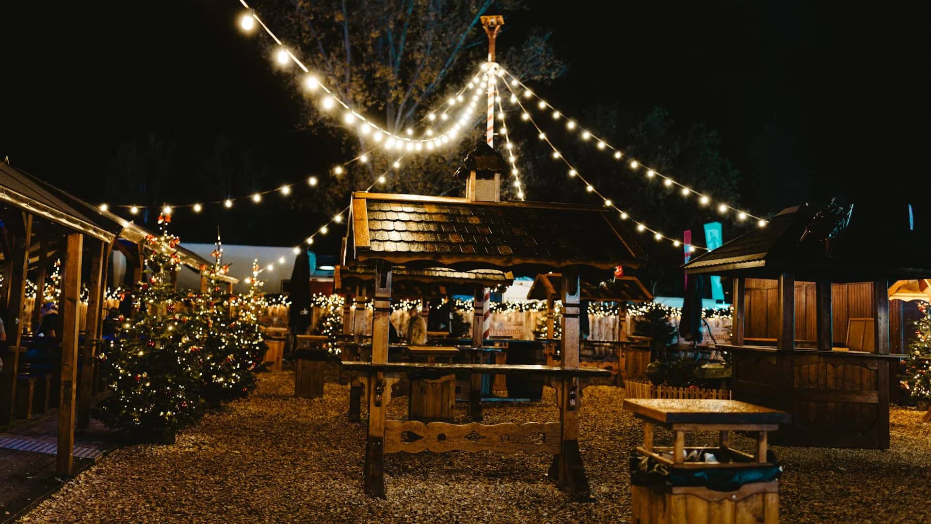 Berlin Christmas market square with warm lights and festive stalls