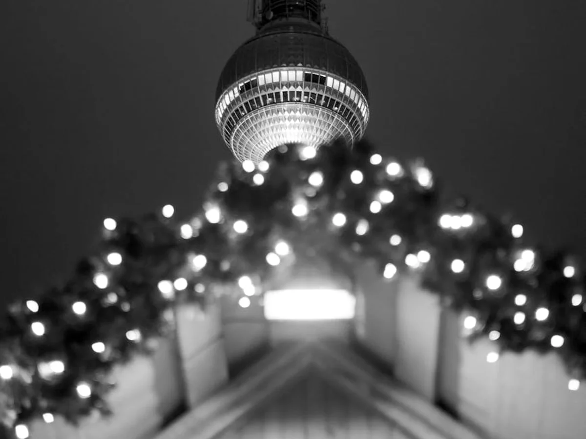 Berlin TV Tower illuminated by Christmas lights in winter night