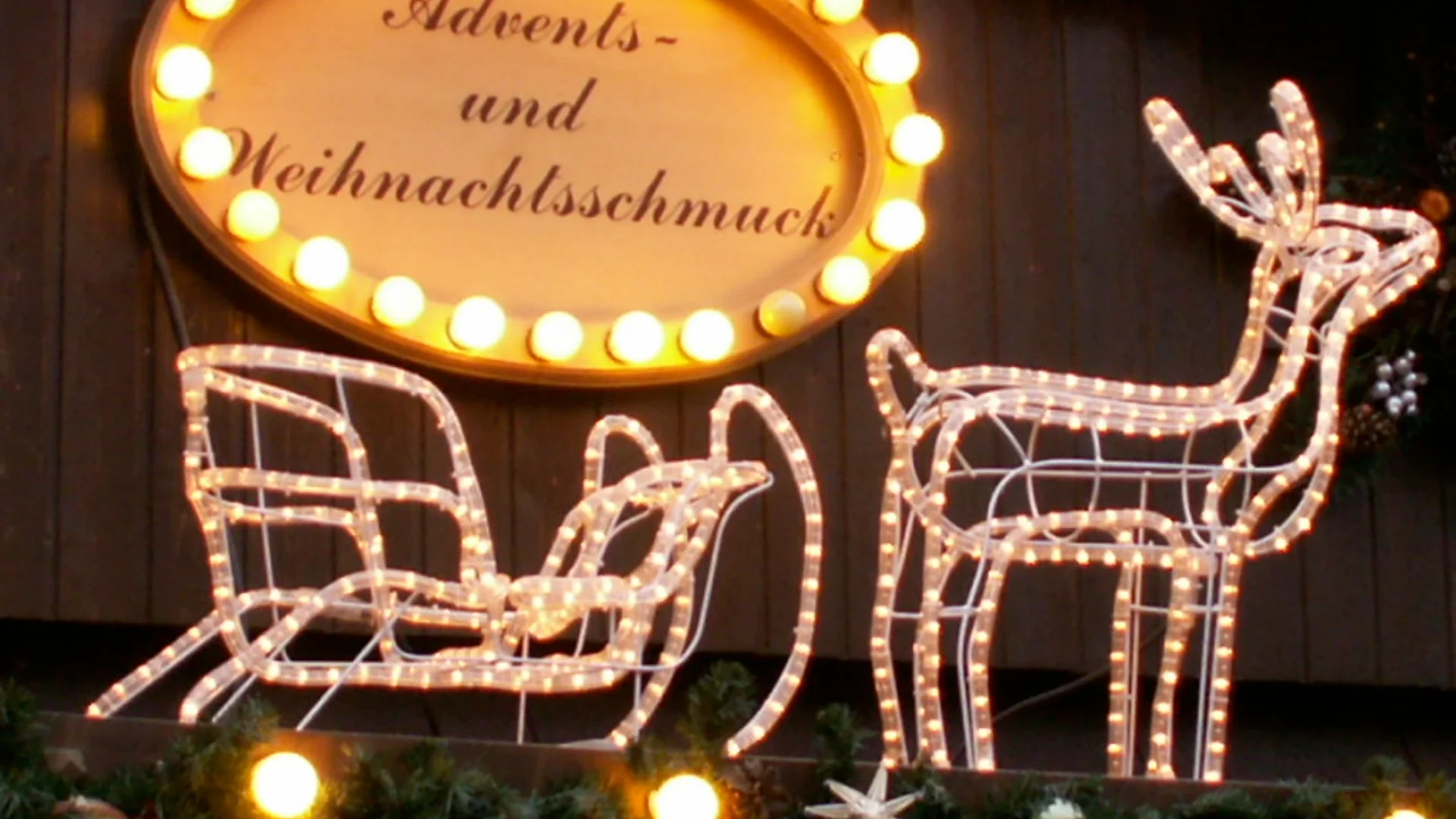Bonner Weihnachtsmarkt - Vivatsgasse illuminated stall in Bonn's festive atmosphere
