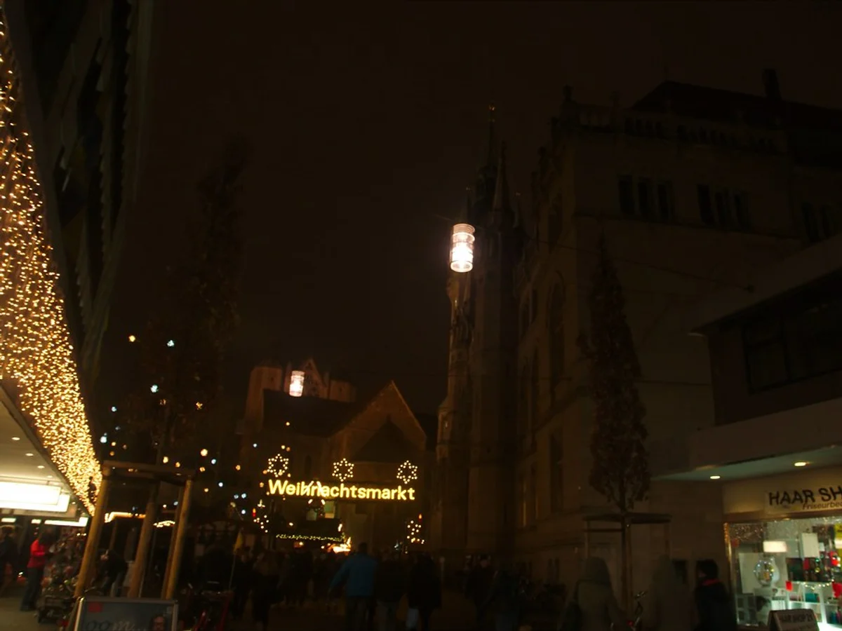 Braunschweiger Weihnachtsmarkt aerial view Burgplatz blue hour with illuminated Martinskirche and castle