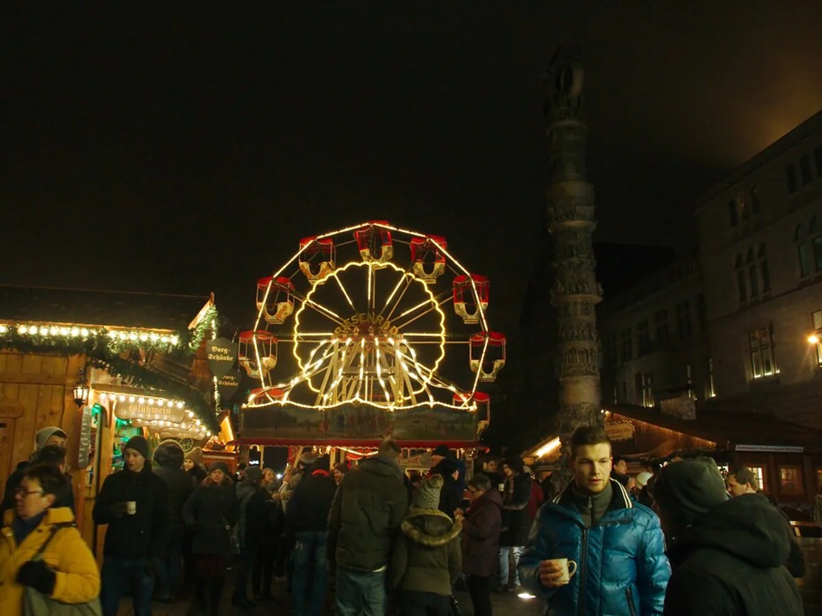 Braunschweiger Weihnachtsmarkt illuminated Ferris wheel Braunschweig magical atmosphere Burgplatz