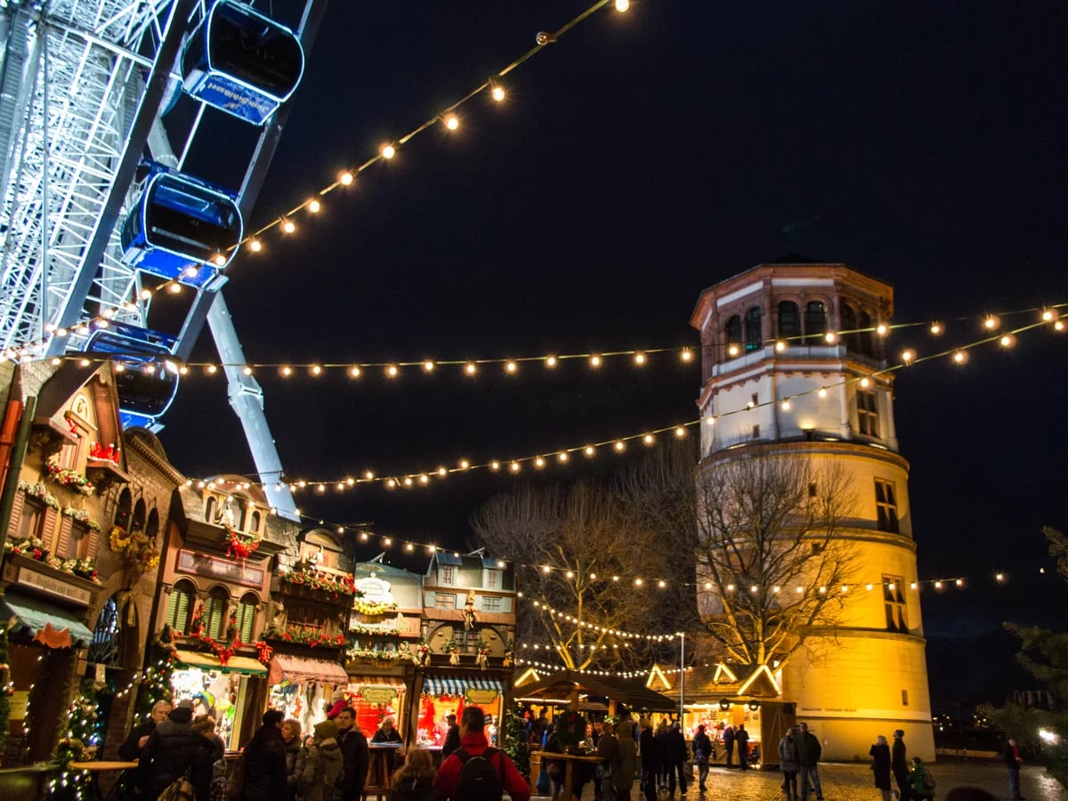 Braunschweiger Weihnachtsmarkt illuminated at Burgplatz, Braunschweig, magical atmosphere with Dankwarderode Castle tower
