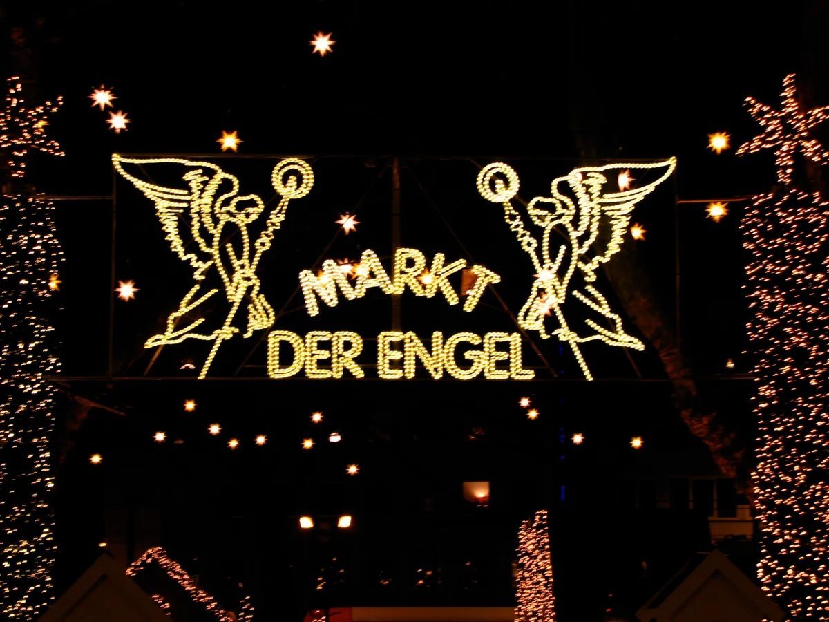 Cologne enchanting Angel Market entrance at night during winter