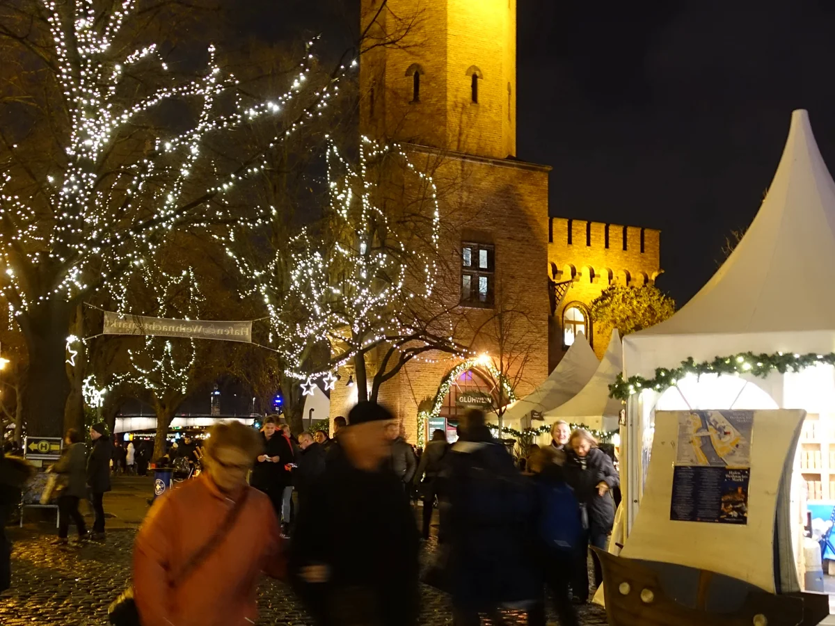 Cologne illuminated Rhine Tower during festive Christmas market season