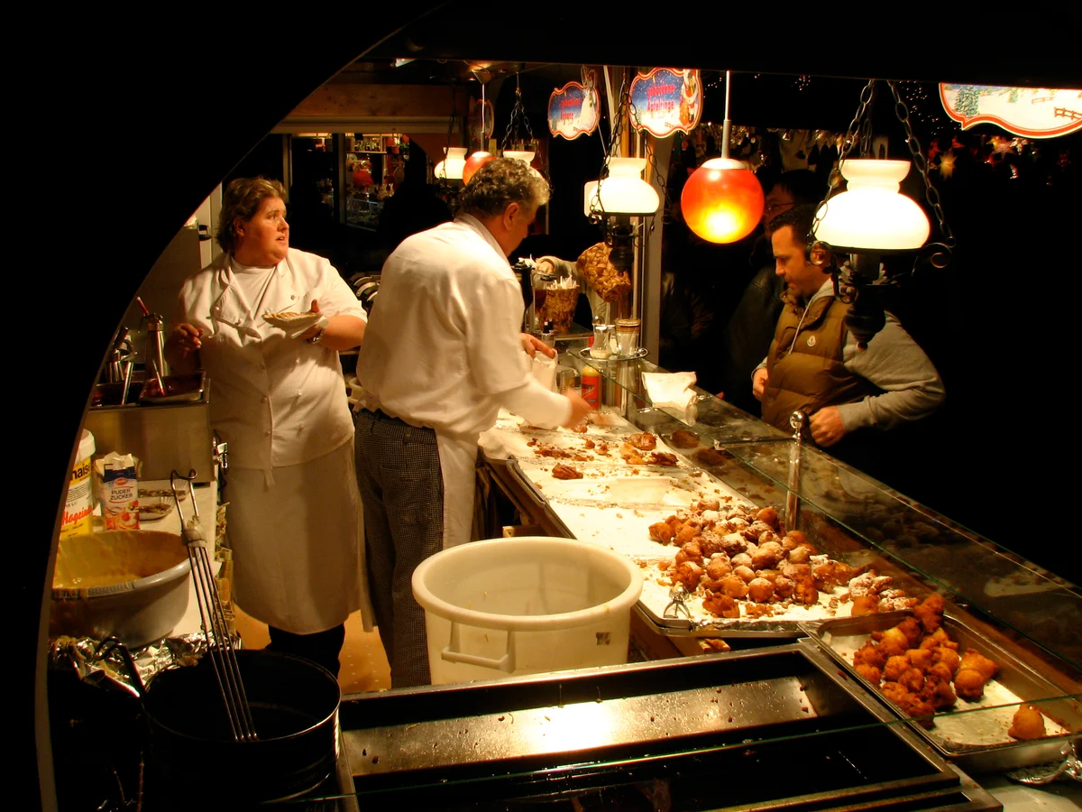 Cologne evening market scene with warm golden lighting at Christmas