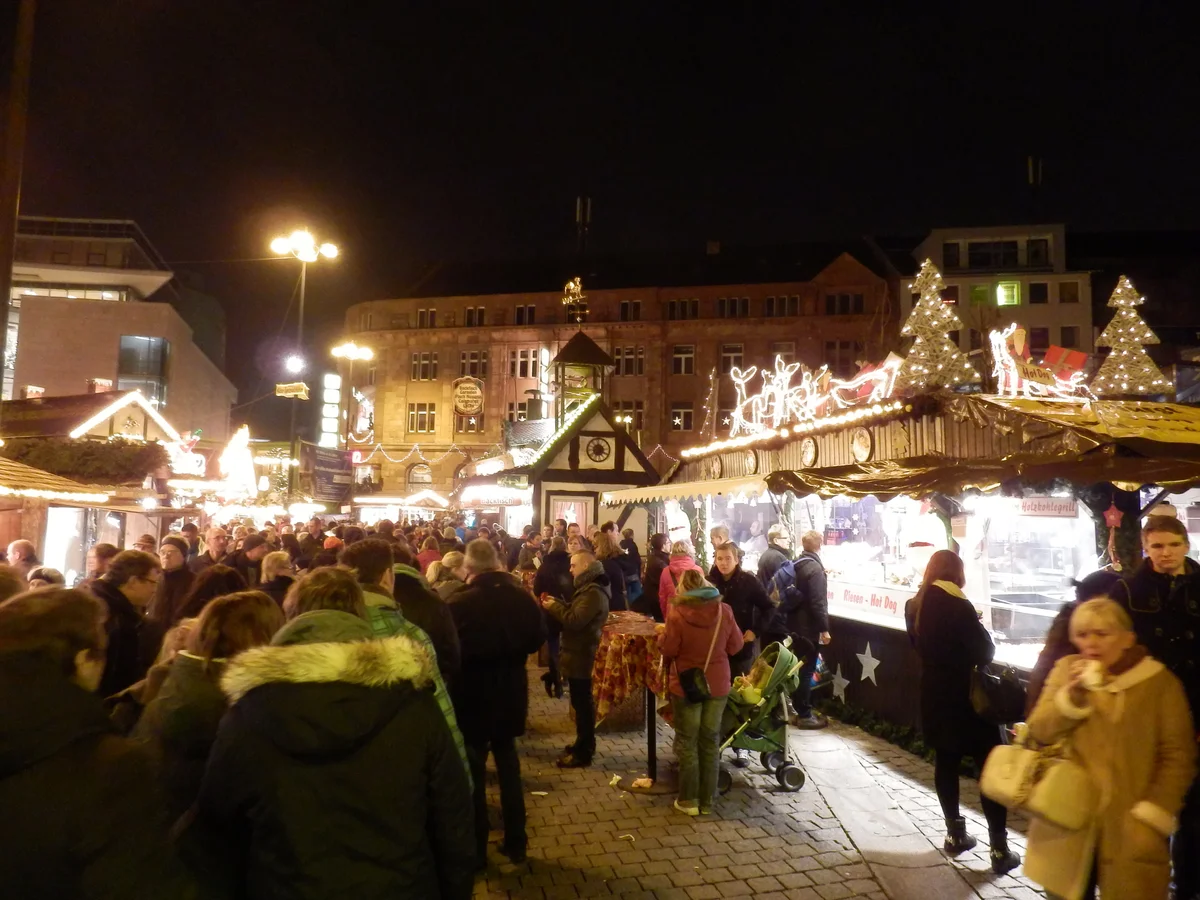 Dortmund bustling Christmas market at dusk with festive lights