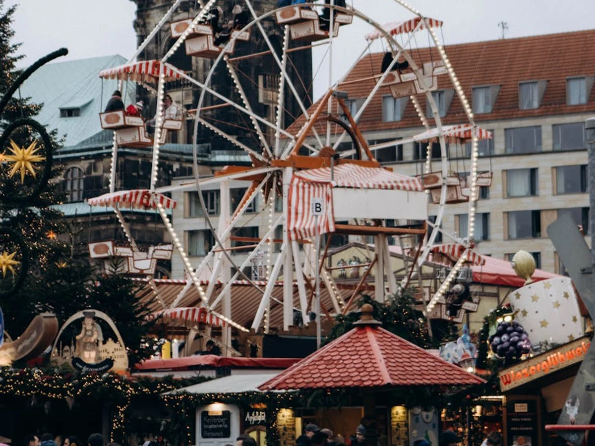 Dresden vintage carousel with Kreuzkirche clock tower in winter atmosphere