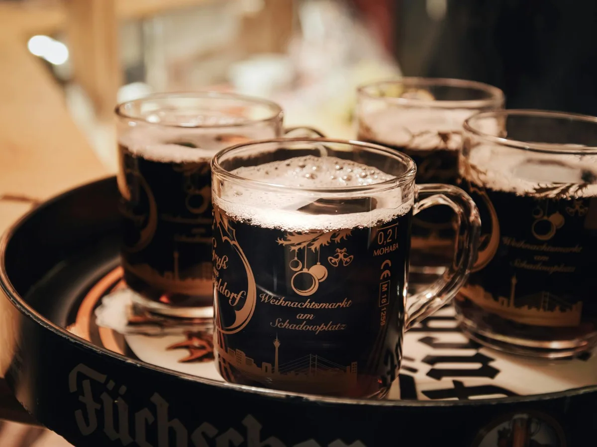Düsseldorf closeup of Schadowplatz Christmas market mugs filled with mulled wine